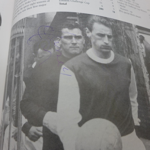 668 - Football; a copy of Arsenal Who's Who containing over 30 signatures from former players including Jo... 