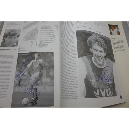 668 - Football; a copy of Arsenal Who's Who containing over 30 signatures from former players including Jo... 