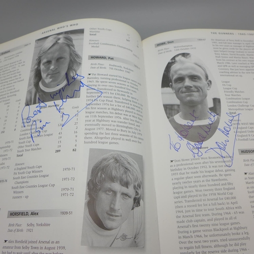 668 - Football; a copy of Arsenal Who's Who containing over 30 signatures from former players including Jo... 