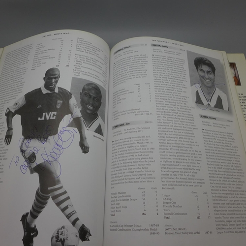 668 - Football; a copy of Arsenal Who's Who containing over 30 signatures from former players including Jo... 