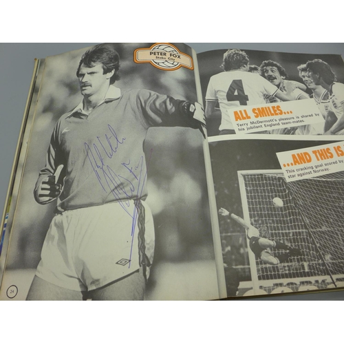 681 - Football; a copy of the original Topical Times Football book 1982 containing several signatures from... 