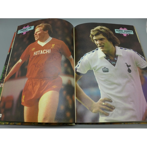 682 - Football; a copy of the Topical Times football book 1983 containing several signatures from former f... 