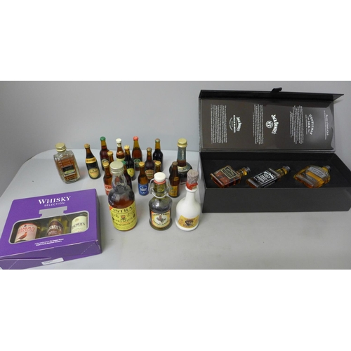 691 - A collection of alcohol miniatures including a set of three Jack Daniels, other whisky and miniature... 