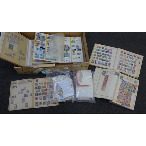 698 - A collection of stamps, four albums, a paperback collectors album and loose stamps