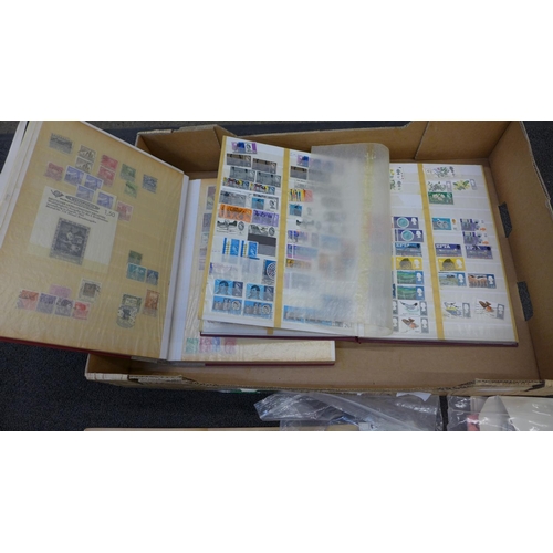 698 - A collection of stamps, four albums, a paperback collectors album and loose stamps