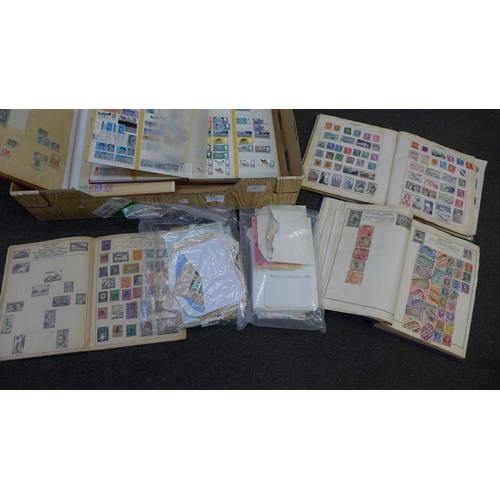 698 - A collection of stamps, four albums, a paperback collectors album and loose stamps