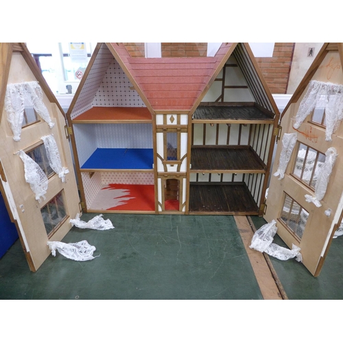 769 - A Tudor style doll's house  **PLEASE NOTE THIS LOT IS NOT ELIGIBLE FOR POSTING AND PACKING**