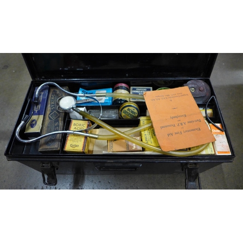 771 - A large vintage first aid box containing medical supplies and books