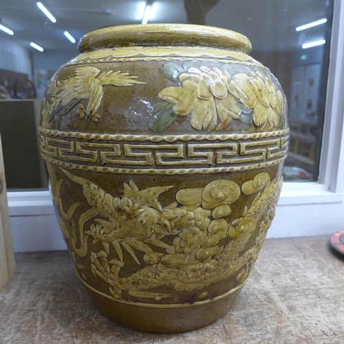 786 - A large oriental vase decorated with dragons, 38cm