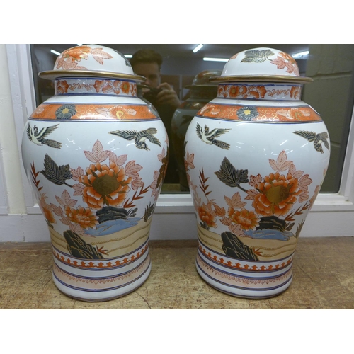 787 - A pair of large Chinese temple jars, tops lacking, 46cm