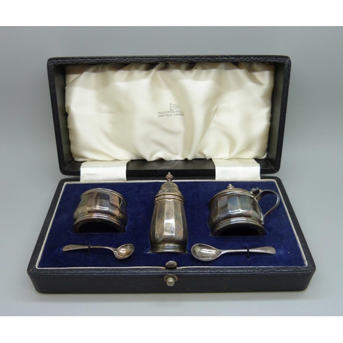 810 - A three piece silver condiment set, Walter & Hall, cased, 72g