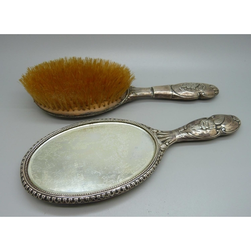 819 - Two silver backed brushes decorated with Reynolds angels, a/f