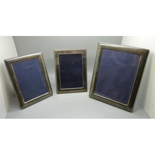 821 - Three silver photograph frames, largest 17cm x 22cm