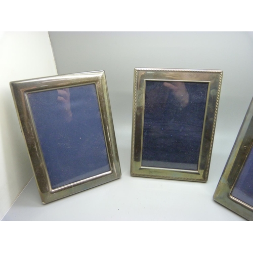 821 - Three silver photograph frames, largest 17cm x 22cm