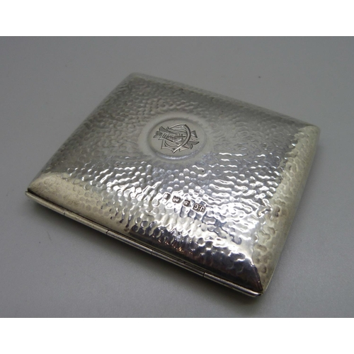 823 - A hammered silver cigarette case, with monogram, Birmingham 1908, 97g, 70mm x 83mm