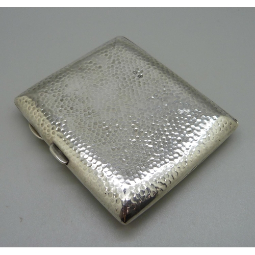 823 - A hammered silver cigarette case, with monogram, Birmingham 1908, 97g, 70mm x 83mm