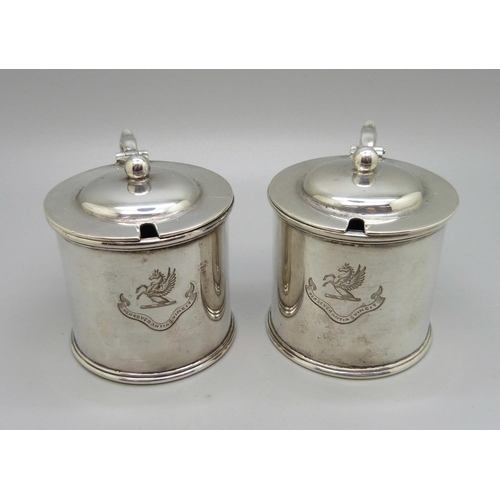 839 - A pair of silver mustards, with crests, one lacking liner, 315g