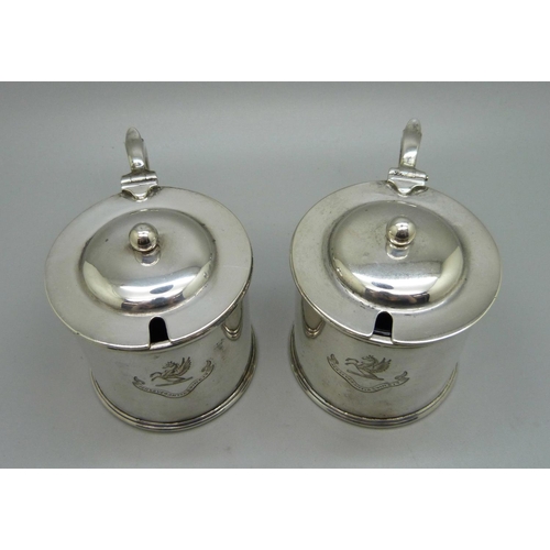 839 - A pair of silver mustards, with crests, one lacking liner, 315g