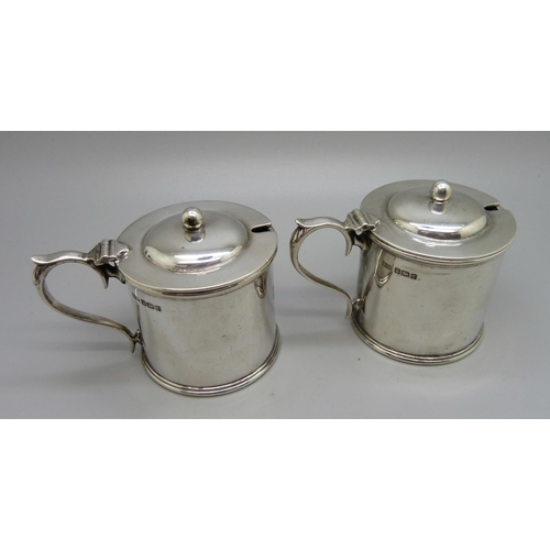 839 - A pair of silver mustards, with crests, one lacking liner, 315g