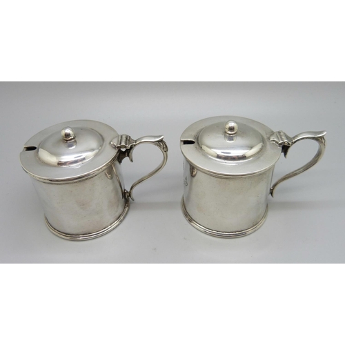 839 - A pair of silver mustards, with crests, one lacking liner, 315g