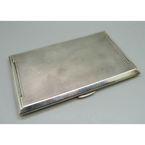 857 - A large silver Art Deco cigarette case, Birmingham 1942, inner case bears inscription, 218g