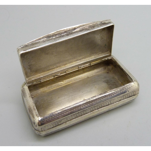 858 - A white metal snuff box, the top with bird detail, with diamond shaped control mark, 58mm wide