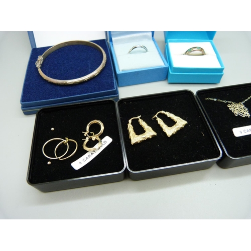 879 - Four pairs of yellow metal earrings and a pendant and chain, 3.3g, (two pairs of earrings and the ch... 