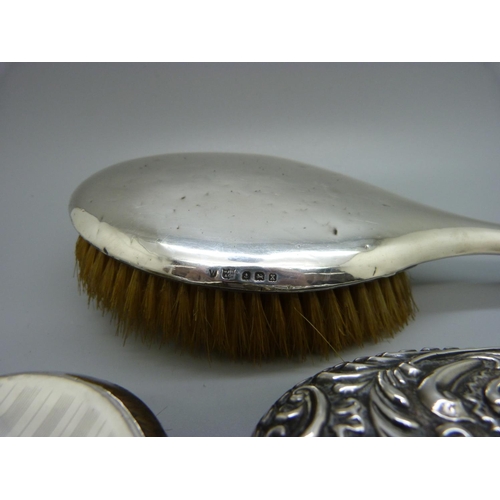 880 - Three silver backed brushes, a/f