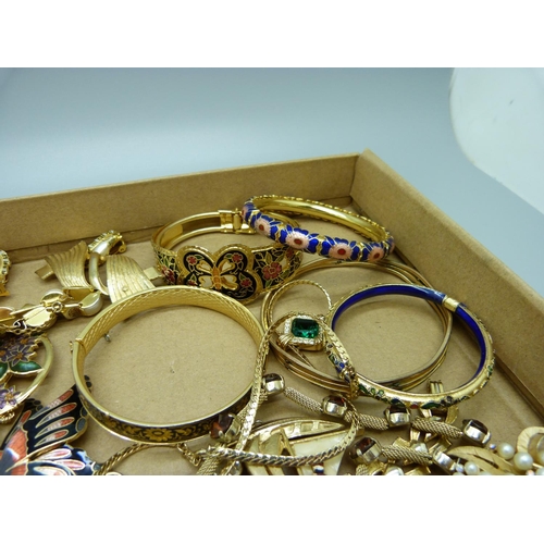 911 - A collection of gold tone costume jewellery including a Trifari brooch