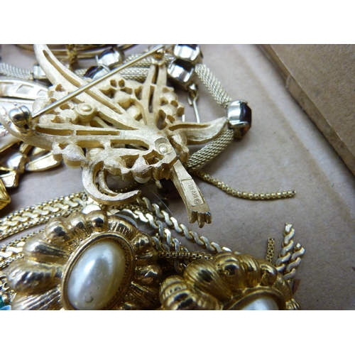 911 - A collection of gold tone costume jewellery including a Trifari brooch