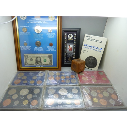 919 - A collection of GB coin sets, framed American coins, Famous Presidents of the USA, a framed Elvis st... 