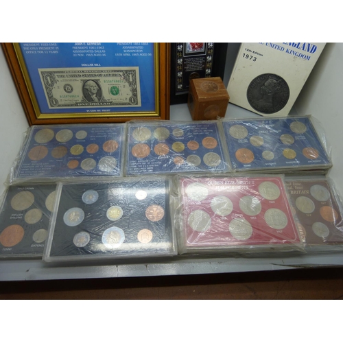 919 - A collection of GB coin sets, framed American coins, Famous Presidents of the USA, a framed Elvis st... 