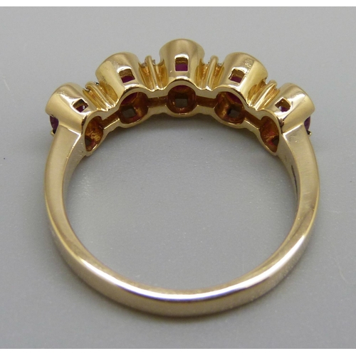 929 - A 9ct gold, ruby and diamond ring, 4.8g, O