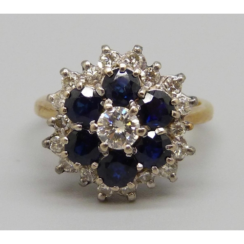 949 - An 18ct gold, sapphire and diamond cluster ring, 6.5g, O, nineteen diamonds approximately 1ct weight... 