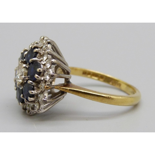 949 - An 18ct gold, sapphire and diamond cluster ring, 6.5g, O, nineteen diamonds approximately 1ct weight... 