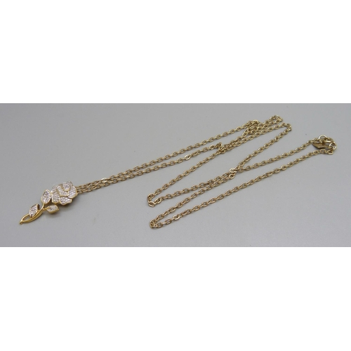 952 - A silver gilt pendant with diamond accent on a Sarah Coventry chain