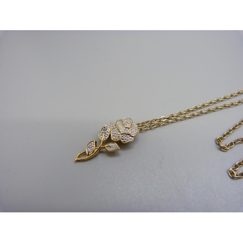 952 - A silver gilt pendant with diamond accent on a Sarah Coventry chain