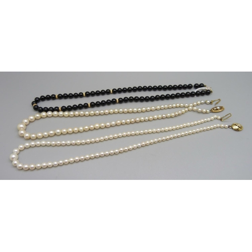 955 - Two pearl necklaces with 9ct gold clasps, one clasp lacking a pearl, and a black bead necklace with ... 