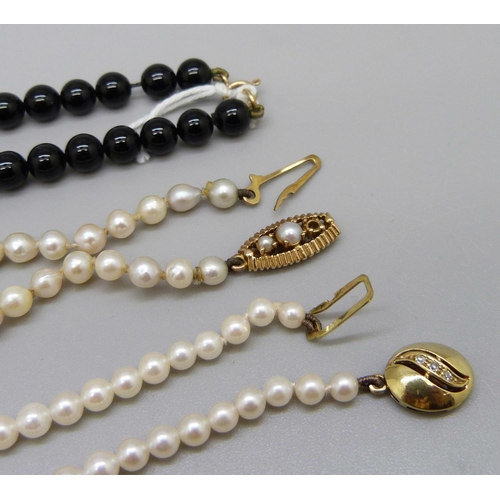 955 - Two pearl necklaces with 9ct gold clasps, one clasp lacking a pearl, and a black bead necklace with ... 