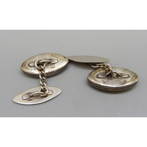 973 - A pair of silver cufflinks set with Blue John, small chip to the Blue John