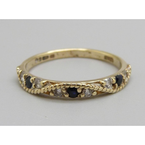 974 - A 9ct gold, sapphire and white stone ring, 1.6g, O