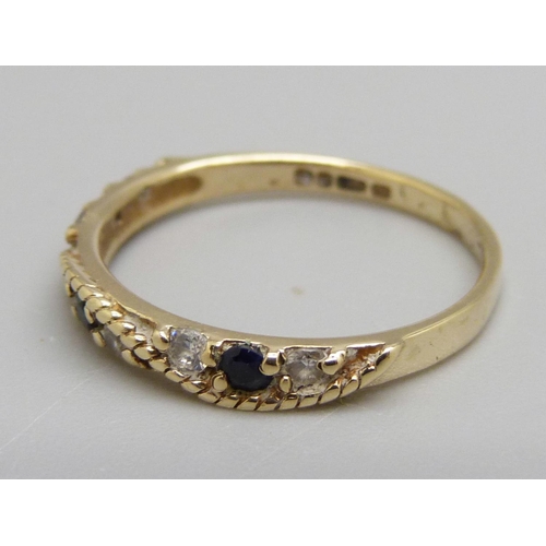 974 - A 9ct gold, sapphire and white stone ring, 1.6g, O