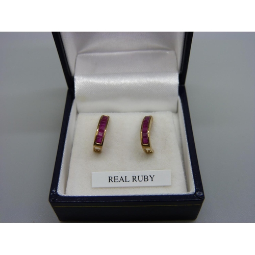 979 - A pair of 9ct gold and ruby earrings, 1.6g, boxed