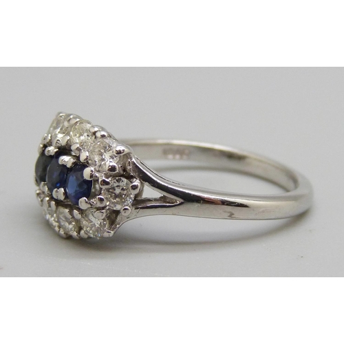 982 - An 18ct white gold, sapphire and diamond ring, 0.80ct diamond weight, 5.2g, N