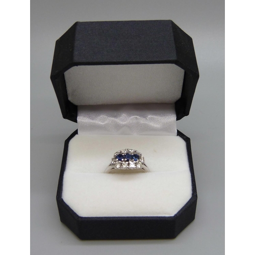 982 - An 18ct white gold, sapphire and diamond ring, 0.80ct diamond weight, 5.2g, N