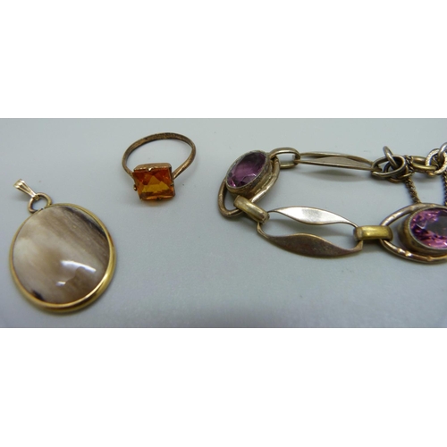 991 - A rolled gold bracelet, a ring and a pendant