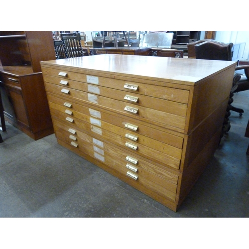 120 - A light oak plan chest