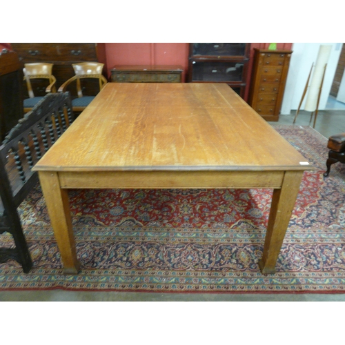 13 - An early 20th Century oak library table