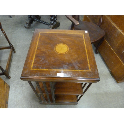 132 - An inlaid mahogany revolving bookcase