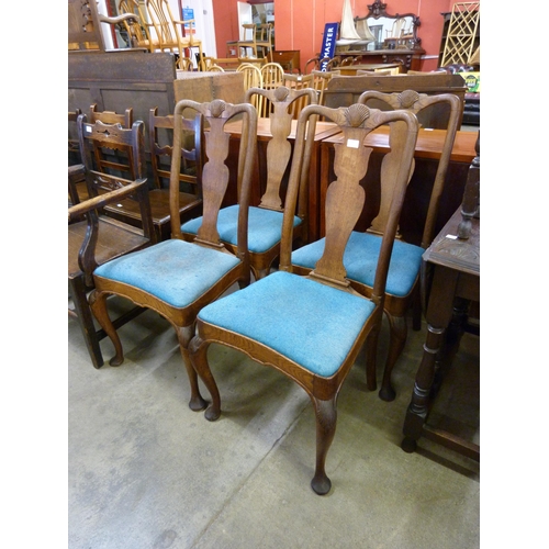 135 - A set of four Queen Anne style oak dining chairs